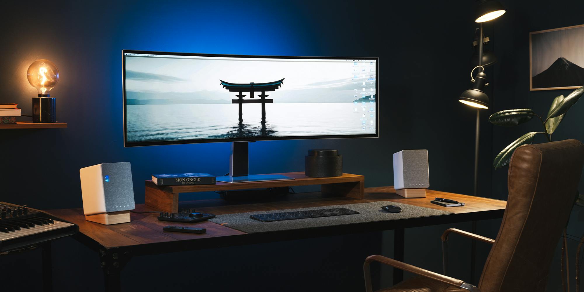 Onkyo Creator GX 30 ARC on desk in dark blue office with moody lighting and Japanese gate on desktop screen 2000x1000