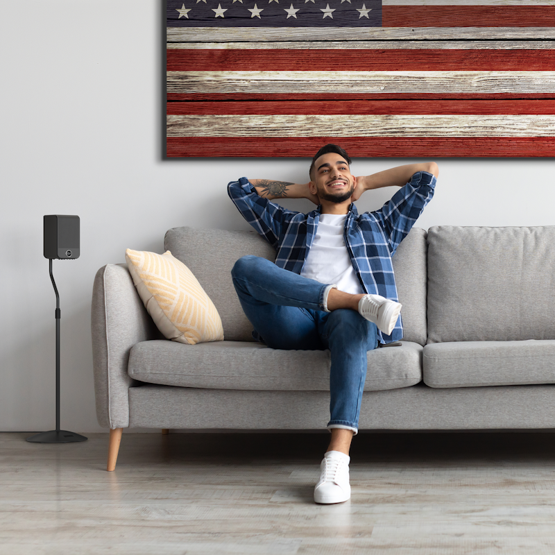 Klipsch Flexus SURR 100 beside relaxing guy 2000x2000