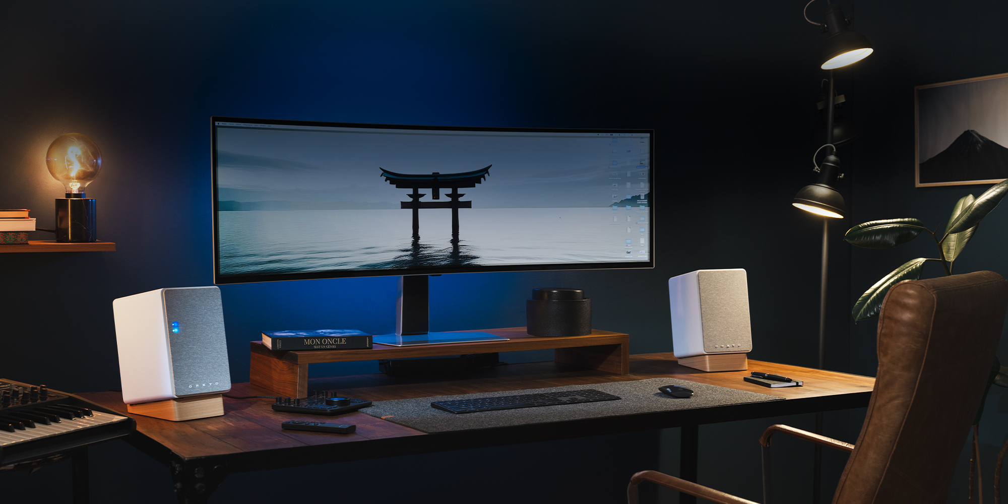 Onkyo Creator GX 30 ARC white grilles on desk in dark blue office with moody lighting and Japanese gate on desktop screen 2000x1000