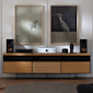 Onkyo Icon A 50 and C 30 Silver and Klipsch bookshelf speakers on media console with crane art on wall behind 2000x2000